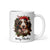A merry Christmas coffee mug with an image of a spaniel wearing a Christmas hat, perfect for dog lovers.